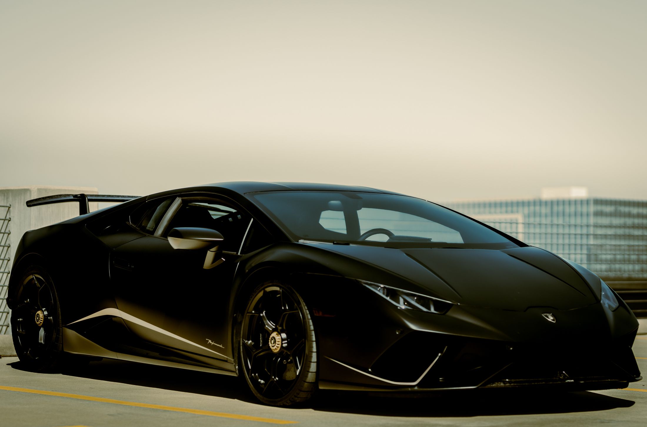 Black performance car in warm evening light